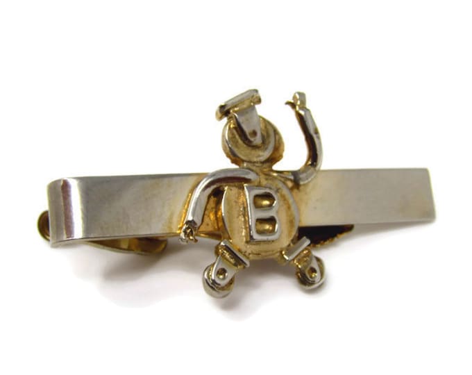Vintage Tie Bar Tie Clip: Wheel Casters Logo Man Design B Body Gold Tone