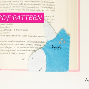 May include: A PDF pattern for a blue and white unicorn bookmark. The pattern includes instructions for sewing the bookmark and adding details like eyes, a horn, and stars.