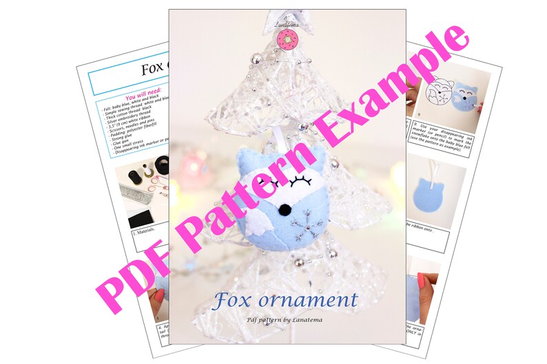 May include: A PDF pattern for a blue felt fox ornament. The pattern includes instructions and a template for creating the ornament. The fox has a white face with black eyes and a snowflake on its chest. The text "Fox ornament" and "PDF pattern by Lanatema" is visible on the page.