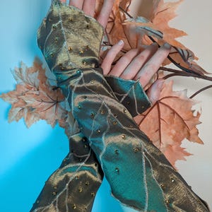 May include: A set of three ceramic mugs with a speckled, matte finish. The mugs are in shades of cream, light gray, and dark gray. Each mug has a simple, minimalist design, perfect for coffee or tea.