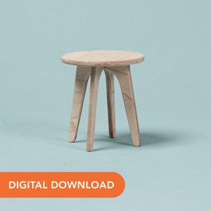 May include: A small, unfinished wooden stool with a round top and three curved legs. The stool is made of light-colored wood and stands on a light blue background. The text "DIGITAL DOWNLOAD" is in an orange rectangle at the bottom.