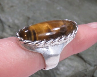 13.6 grams sterling silver ring, tiger's eye, size 6 3/4 on the mandrel, vintage