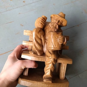 Vintage hand carved musician figure