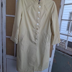 May include: A set of three ceramic mugs with a speckled, matte finish. The mugs are in shades of cream, light gray, and dark gray. Each mug has a simple, minimalist design and a rounded handle.