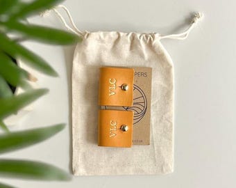 Cable tidies, cord keepers, personalised leather, gold foil