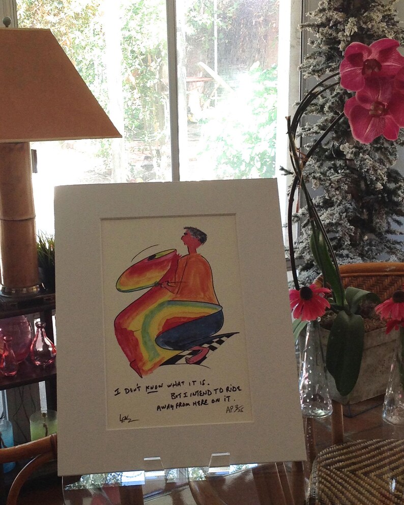 May include: A framed illustration of a person riding a rainbow-colored object. The caption reads "I don't know what it is. But I intend to ride away from here on it."
