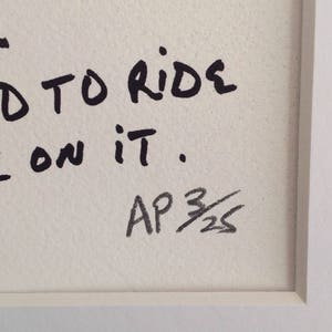 May include: Black and white handwritten text on a white background reads "...d to ride on it."  The text is signed "AP 3/25".