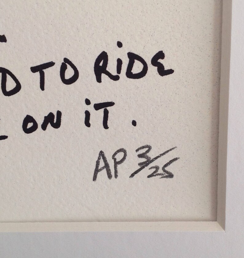 May include: Black and white handwritten text on a white background reads "...d to ride on it."  The text is signed "AP 3/25".