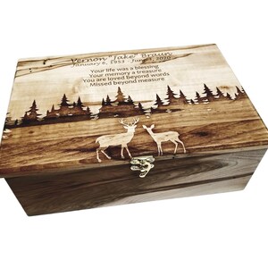 a wooden box with a picture of two deer on it