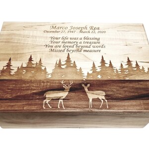 a wooden box with a picture of two deer