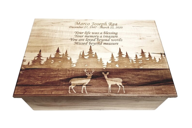 a wooden box with a picture of two deer