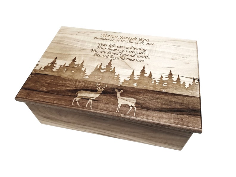 a wooden box with a picture of two deers