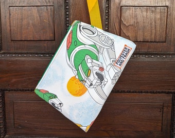 Vintage fabric zipper bag with a 1980s Voltron sheet, wrist strap, vintage sheet lining, fully interfaced