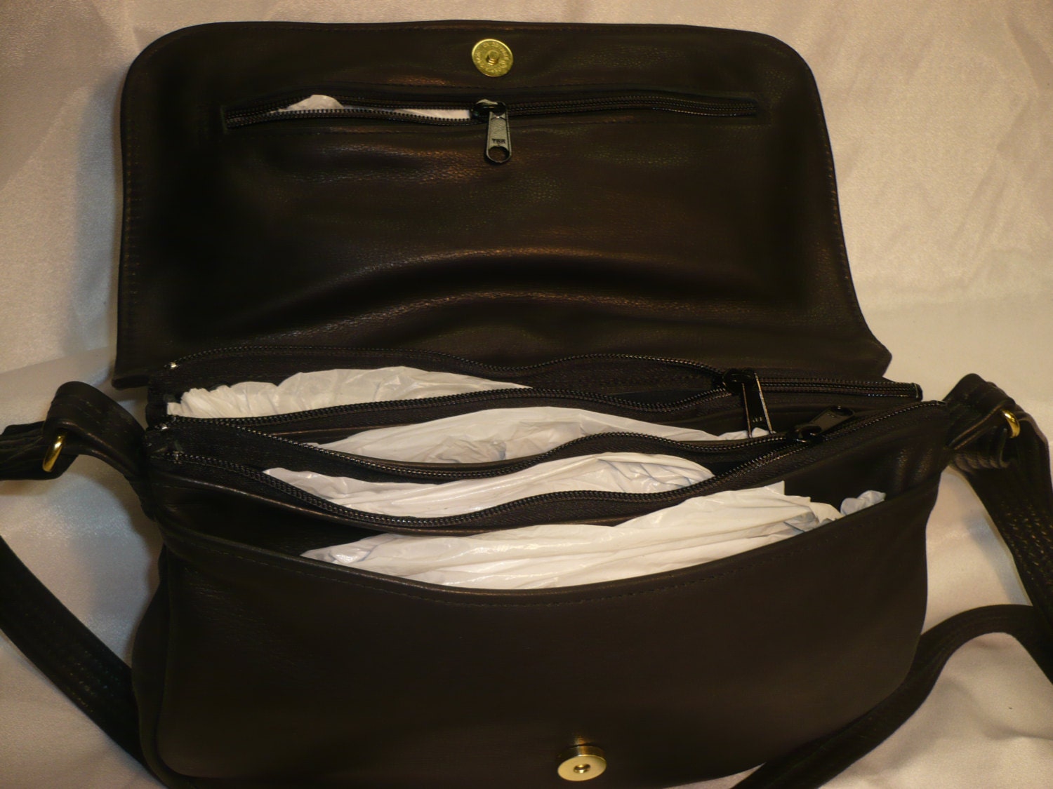 multi compartment leather handbag