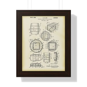 May include: Framed vintage patent print of a container assembly for aging whiskey, dated July 5, 1966. The print features detailed technical drawings of a barrel and related components, with the inventor's name and patent number.