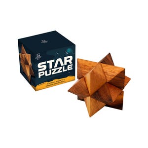 May include: A wooden star puzzle with a box. The box is dark blue with the words "STAR PUZZLE" in white. The puzzle is made of interlocking wooden pieces. The puzzle is a star shape.