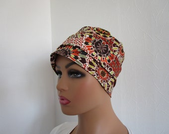 Bonnet rétro turban chimio en jersey de couleur orange, marron, anis et blanc motif mandala