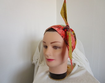 Foulard, turban chimio  de couleur orange, ocre, rouge, marron bordeaux et beige à motif fleuri