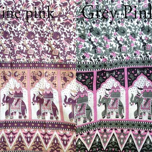 May include: Two fabric swatches with a repeating pattern of elephants and floral designs. The left swatch is labeled "Wine Pink" and the right swatch is labeled "Grey Pink".