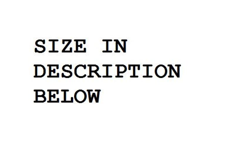 May include: Text on a white background reads "SIZE IN DESCRIPTION BELOW" in a bold, sans-serif font. The text is centered and stacked, with each line clearly visible.