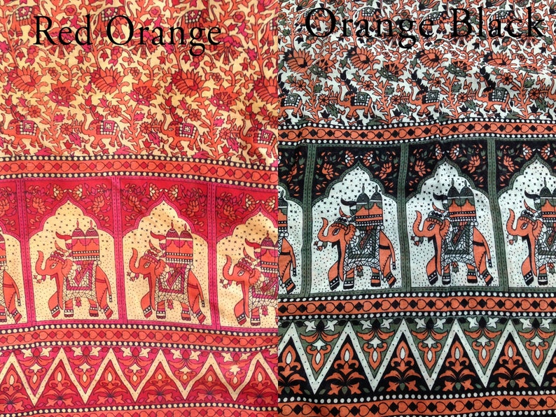 May include: Two fabric swatches with an Indian-inspired design featuring elephants, arches, and floral patterns. The left swatch is red and orange, while the right swatch is orange and black.
