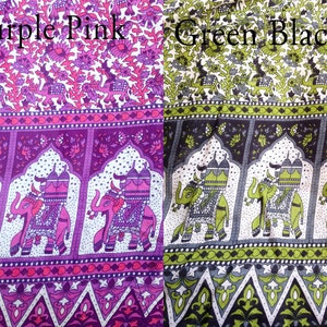 May include: Two fabric swatches with a repeating pattern of elephants and floral designs. The left swatch is purple and pink, and the right swatch is green and black. The text "Purple Pink" is printed above the left swatch, and the text "Green Black" is printed above the right swatch.