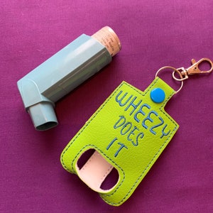 Embroidered Humorous Asthma Inhaler Holder "WHEEZY DOES IT"