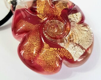 Large ruby colored snail pendant in lampworked Murano glass.