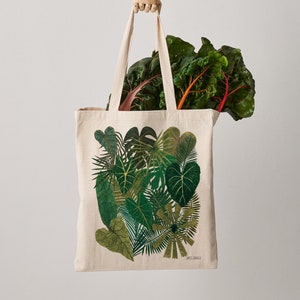 High quality and durable fair trade natural canvas tote bag featuring a vibrant leafy green botanical pint.