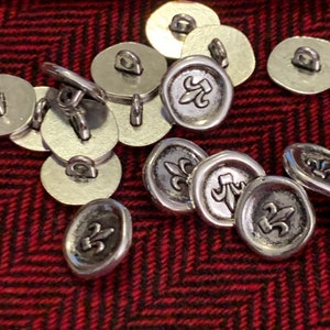 Silver colored metal flour de lis irregular shape 15mm buttons, set of 10