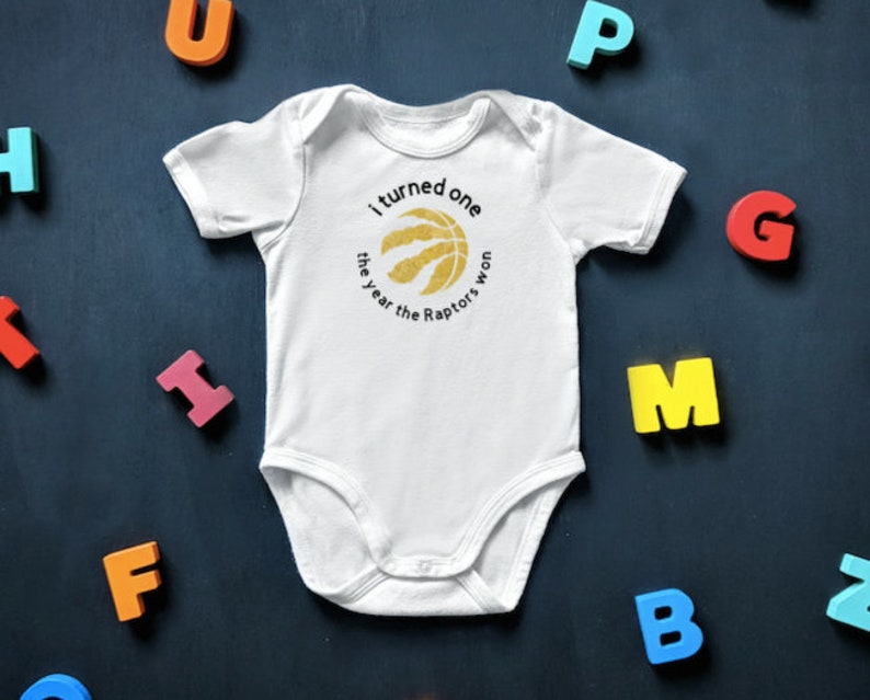 raptors baby onesie
