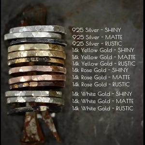 May include: A stack of twelve hammered metal rings in silver, yellow gold, rose gold, and white gold, each with shiny, matte, or rustic finishes. Text lists: 925 Silver, 14k Yellow Gold, 14k Rose Gold, and 14k White Gold in three finish types.