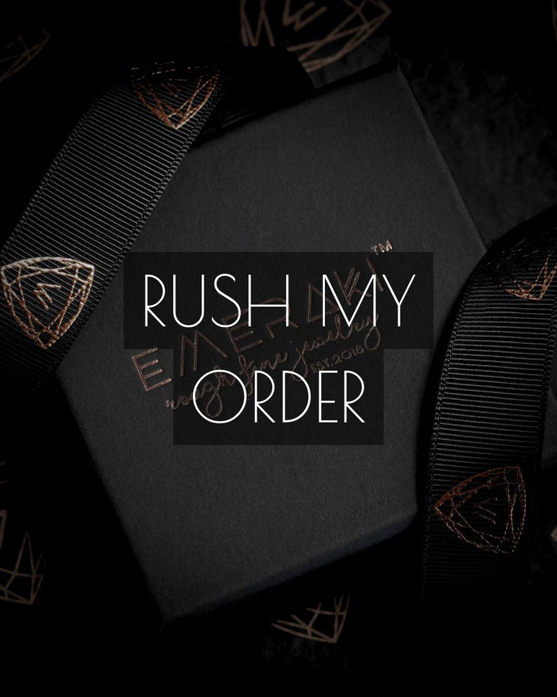 May include: Black gift box with gold accents, featuring the text "RUSH MY ORDER" in white. The box is surrounded by black ribbon with gold geometric designs. The overall aesthetic is elegant and luxurious.