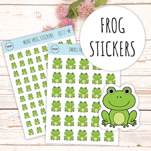 May include: Two sheets of stickers featuring green frog illustrations. One sheet has 49 small frog stickers. The other sheet has 36 larger frog stickers. The text "MINI FROG STICKERS" and "SMALL FROG STICKERS" is printed on the sheets. A separate sticker shows a larger green frog with a white outline.