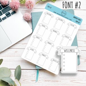 May include: A sheet of printable stickers with a banner design for monthly goals. The stickers are labelled with categories such as personal, wellness, social, travel, business, school, family, finance, work, mindset, and enjoy life. The stickers are designed in a simple black and white style.