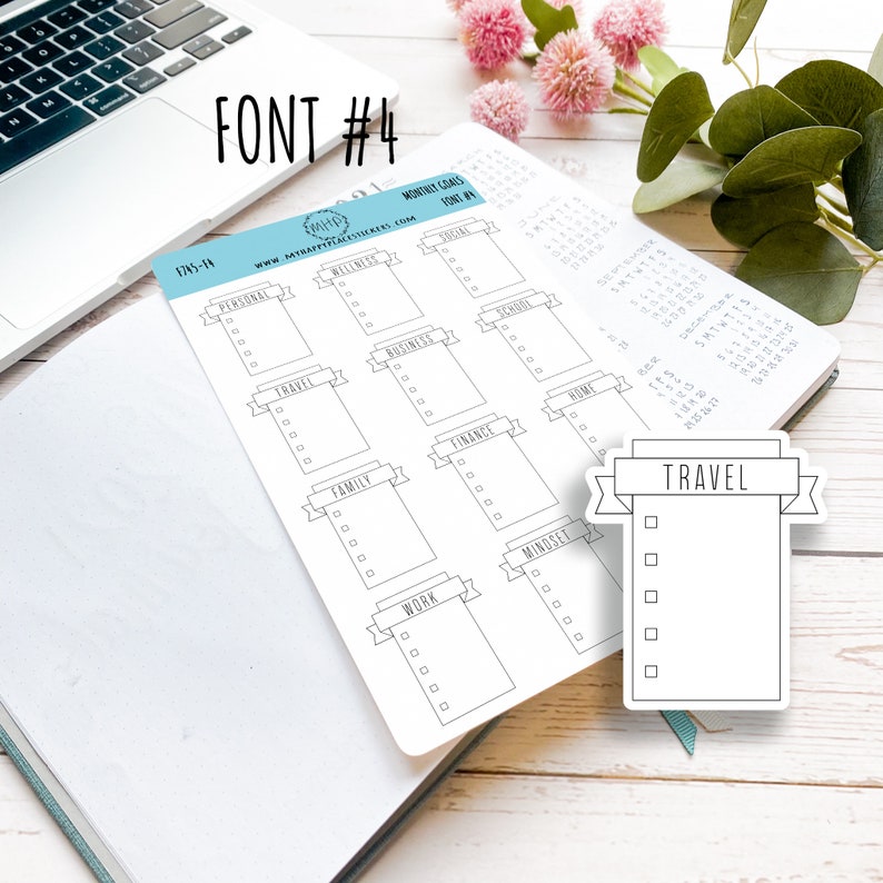 May include: A black and white printable sticker sheet with a checklist for monthly goals. The sheet includes categories such as personal, wellness, social, school, business, finance, home, family, work, and mindset. There is also a separate sticker with the word "TRAVEL" and a checklist.