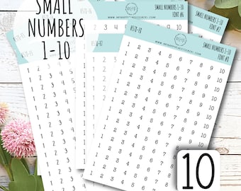 May include: A collection of sticker sheets featuring small numbers 1-10 in various fonts. The sheets are white with black numbers, and the text "SMALL NUMBERS 1-10" is displayed prominently. The image includes a decorative floral element.