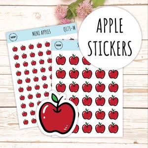 May include: Two sheets of stickers featuring red apple illustrations. The top sheet has the text "MINI APPLES" and "Q173-M". The bottom sheet has the text "APPLE STICKERS".