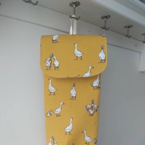 yellow mustard bags storage holder with flap. Bags dispenser. Printed ducks fabric. Kitchen storage.