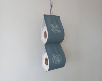 toilet paper storage on the wall. Grey embroidered bath storage. Housewarming. Bathroom decoration. Roll holder