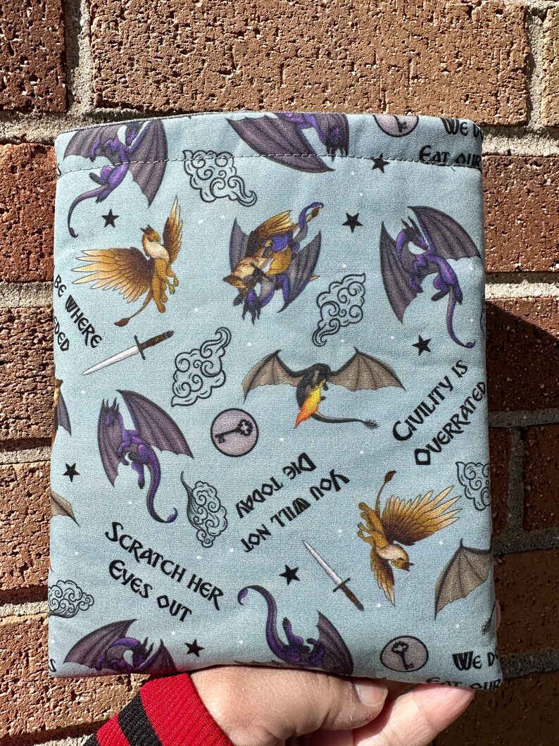 May include: A blue fabric dice bag with a variety of dragon and griffin illustrations. The bag has the text "Die Today You Will Not" and "Civility is Overrated" printed on it.