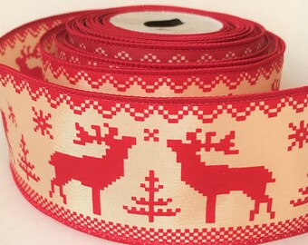 May include: Red and cream ribbon with a repeating pattern of red reindeer and Christmas trees. The ribbon is rolled up and ready to be used for wrapping gifts or decorating.