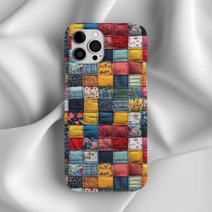 May include: A colorful phone case with a patchwork design. The case is made up of many different squares of fabric, each with a different pattern and color. The case is perfect for adding a touch of personality to your phone.