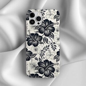 Phone case featuring a black and white hibiscus floral design. Elegant tropical pattern for iPhone or Samsung, combining beachy and minimalist aesthetics.