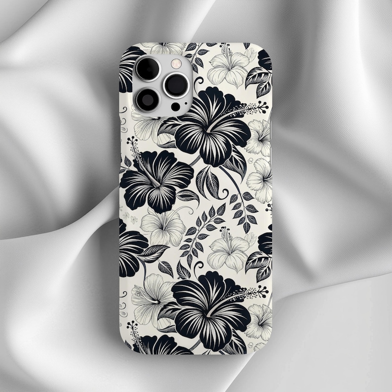 Phone case featuring a black and white hibiscus floral design. Elegant tropical pattern for iPhone or Samsung, combining beachy and minimalist aesthetics.