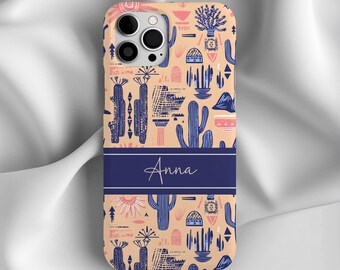 May include: A personalized phone case with a cactus pattern in shades of blue, pink, and beige. The name "Anna" is printed in blue on a navy blue band across the middle of the case.