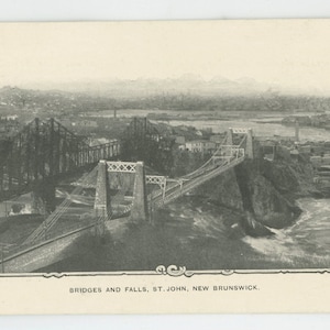 May include: A black and white vintage postcard showing a bridge and falls in St. John, New Brunswick. The postcard reads "Bridges and Falls, St. John, New Brunswick."