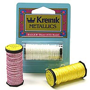 May include: Two spools of Kreinik metallic thread. One spool is pink and the other is yellow. The spools are labeled "Kreinik Metallics" and "Balgeric Dress (420 Braid".