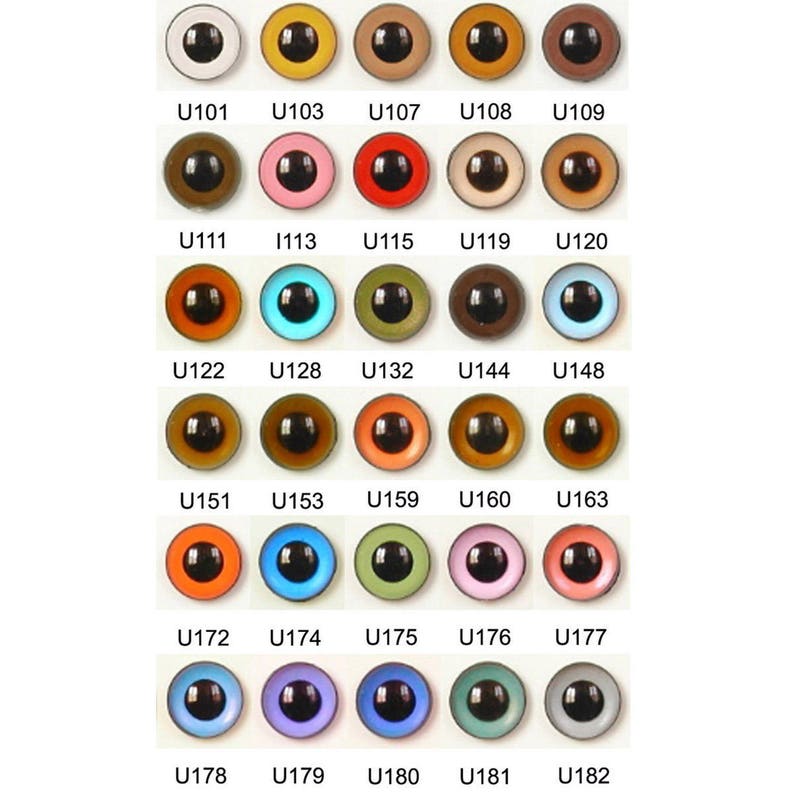 May include: Assortment of plastic doll eyes in various colors and sizes, including black, brown, blue, green, orange, pink, and white. The eyes are labeled with numbers, such as U101, U103, U107, U108, U109, U111, 1113, U115, U119, U120, U122, U128, U132, U144, U148, U151, U153, U159, U160, U163, U172, U174, U175, U176, U177, U178, U179, U180, U181, and U182.
