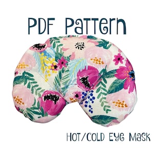 Può includere: Modello PDF per una maschera per gli occhi calda o fredda. La maschera è realizzata in tessuto con una stampa floreale in tonalità rosa, verde e blu.